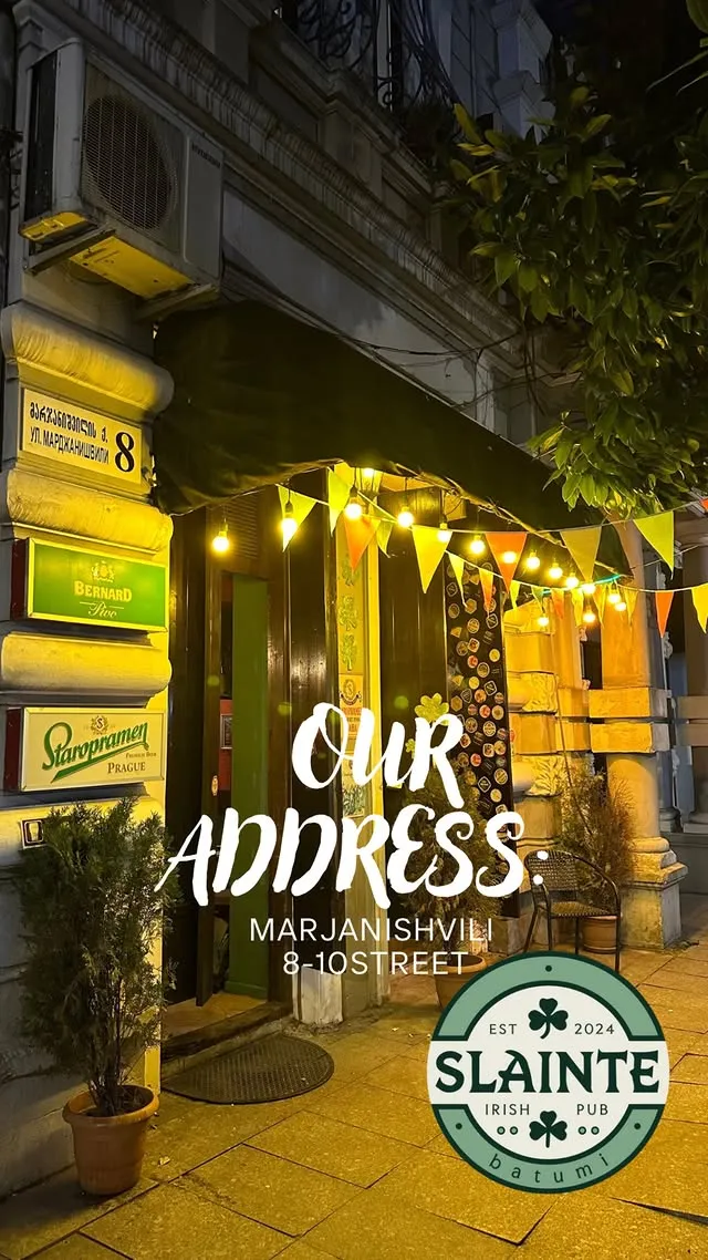 Sláinte Irish Pub exterior at night - warm and welcoming atmosphere